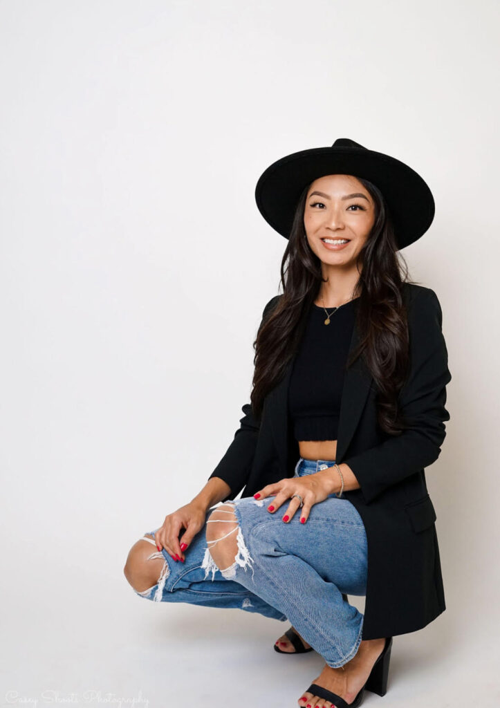 Roam Elopements, Maui Elopements, Woman in black blazer and hat, stylish jeans, red nails. Hair & Makeup Options.