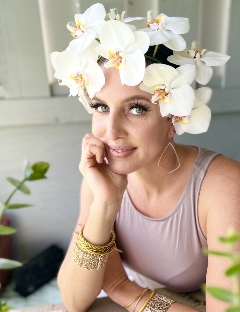 Roam Elopements, Maui Elopements, Woman with orchid flower crown, wearing gold jewelry. Makeup and hair styling.
