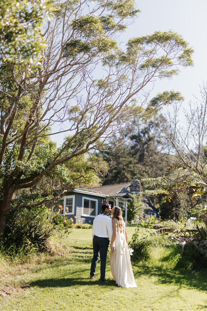 Roam Elopements, Maui Elopements, Couple walking towards a charming house, perfect elopement location.