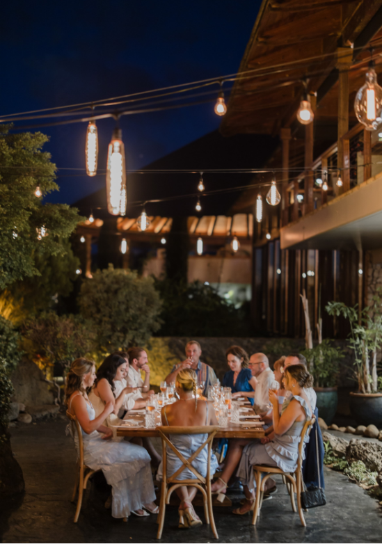 Roam Elopements, Maui Elopements, Micro wedding reception at night, outdoor dining under string lights.