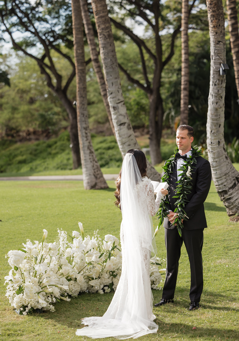 Roam Elopements, Maui Elopements, Bride and groom during a micro wedding ceremony outdoors.